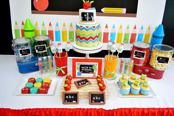 cute blippi back to school party table decor with colorful chevron patterned cake